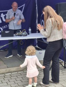 Norman Ross with a young listener